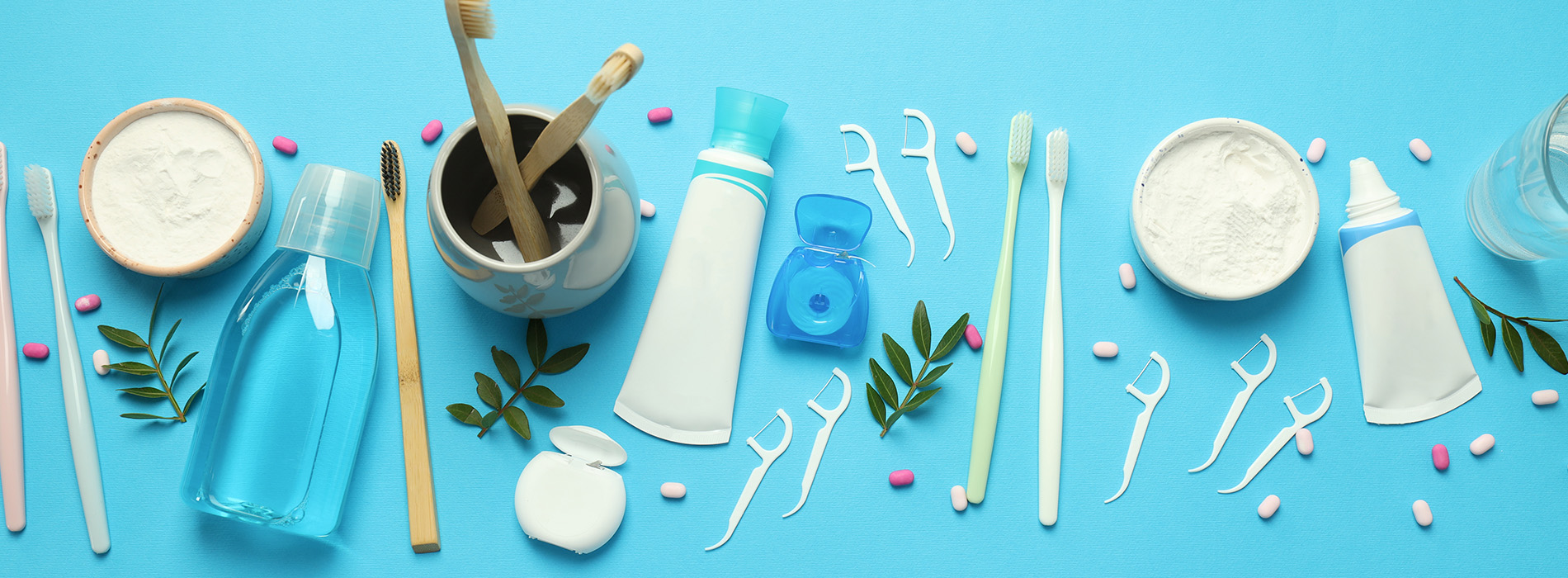 This is a composite image showing medical equipment and supplies, including a stethoscope, blood pressure cuff, tongue depressors, and other instruments, arranged in a manner that suggests they are part of a medical examination or procedure. The background is a solid color to emphasize the items.