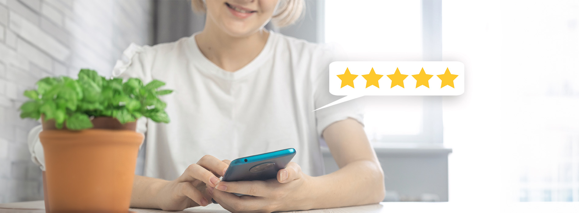 The image shows a hand holding a tablet with a star rating graphic on the screen, indicating high customer satisfaction or approval.